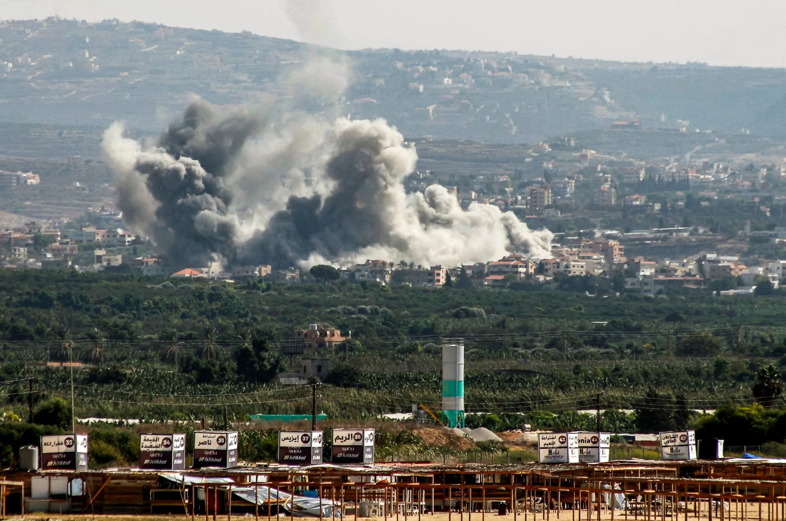 A cloud of smoke erupts following an Israeli airstrike on the village of Deir Qanoun in the southern city of Tyre, Lebanon, Oct. 14, 2024. (AFP Photo)