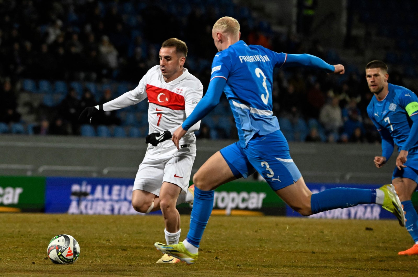 Türkiye&#039;s midfielder #07 Muhammed Kerem Aktürkoğlu (L) and Iceland&#039;s defender #03 Valgeir Fridriksson vie for the ball during the UEFA Nations League, League B Group B4 football match at the Laugardsvollur stadium, Reykjavik, Oct. 14, 2024. (AFP Photo)