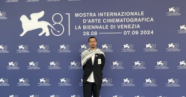 American Japanese filmmaker Neo Sora poses with a Palestinian keffiyeh at the Venice Film Festival, Venice, Italy, Sept. 2, 2024. (AA Photo)