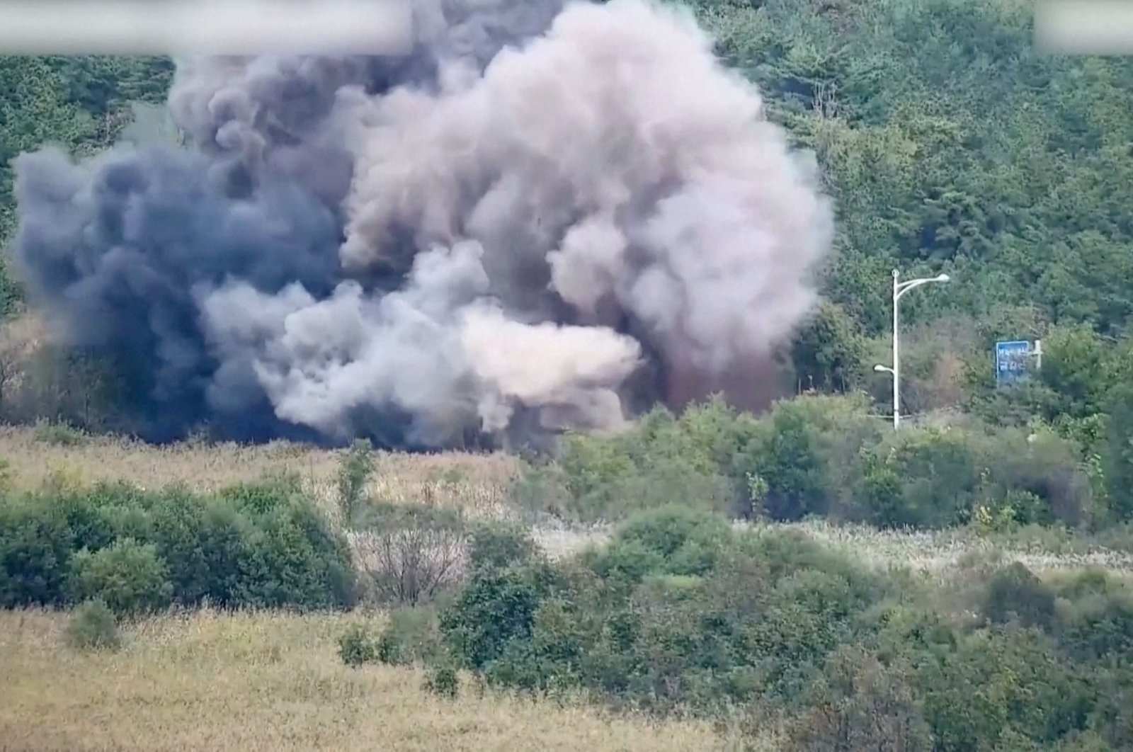 Smoke rises after North Korea blew up sections of inter-Korean roads on its side of the border, Oct. 15, 2024. (Reuters Photo)