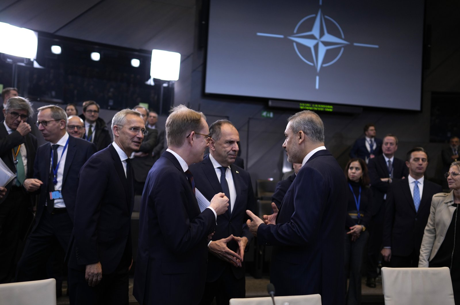 Foreign Minister Hakan Fidan (R) speaks with Greek Foreign Minister Giorgos Gerapetritis (C) during a NATO meeting, Brussels, Belgium, Nov. 28, 2023. (AP Photo)