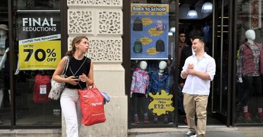 Shoppers walk past a store in Piccadilly Circus, London, U.K., Sept. 2, 2024. (Reuters Photo)