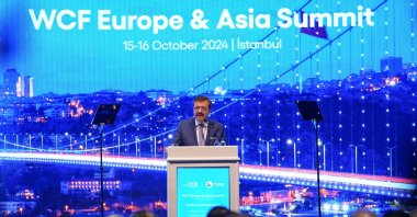 Rifat Hisarcıklıoğlu, the head of Türkiye's Union of Chambers and Commodity Exchanges (TOBB) and president of WCF, delivers a speech at the WCF Europe &amp; Asia Summit, Istanbul, Türkiye, Oct. 15, 2024. (AA Photo)
