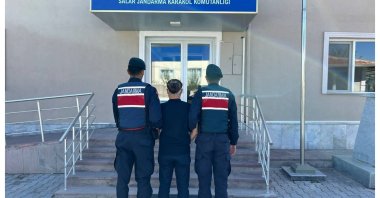 Gendarmerie forces escort a Gülenist Terror Group (FETÖ) suspect, western Afyonkarahisar province, Türkiye, Oct. 8, 2024. (IHA Photo)