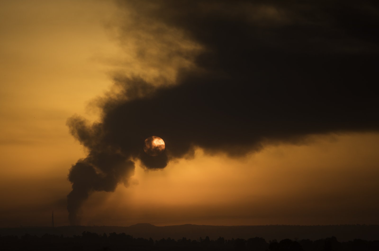 Smoke rises over the Gaza Strip following an Israeli airstrike, as seen from a position from the Israeli side of the border, southern Israel, Jan. 21, 2024. (Getty Images Photo)