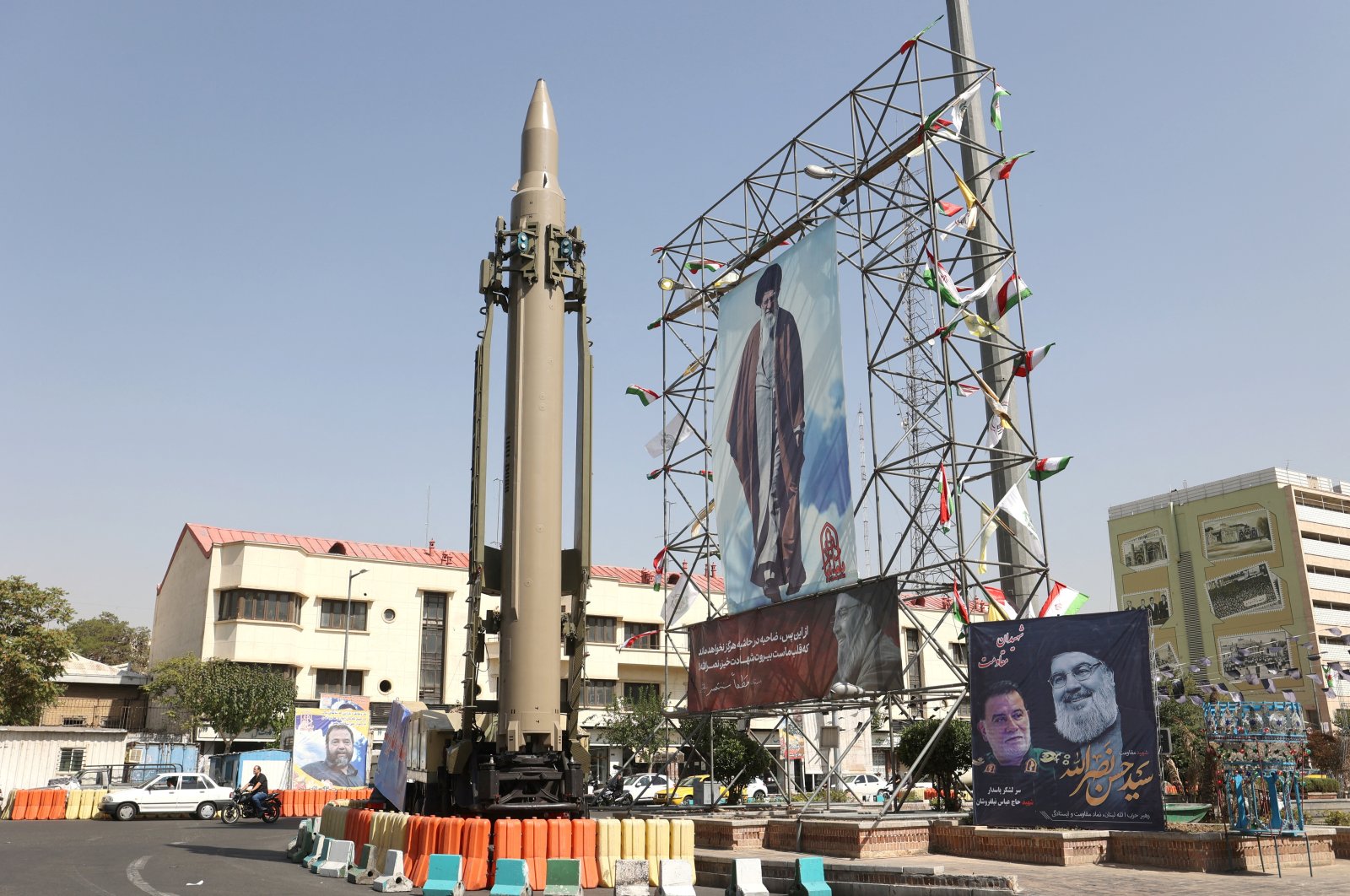 An Iranian missile system is displayed next to a banner with a picture of Iran&#039;s Supreme Leader Ayatollah Ali Khamenei, Tehran, Iran, Oct. 2, 2024. (Reuters Photo)