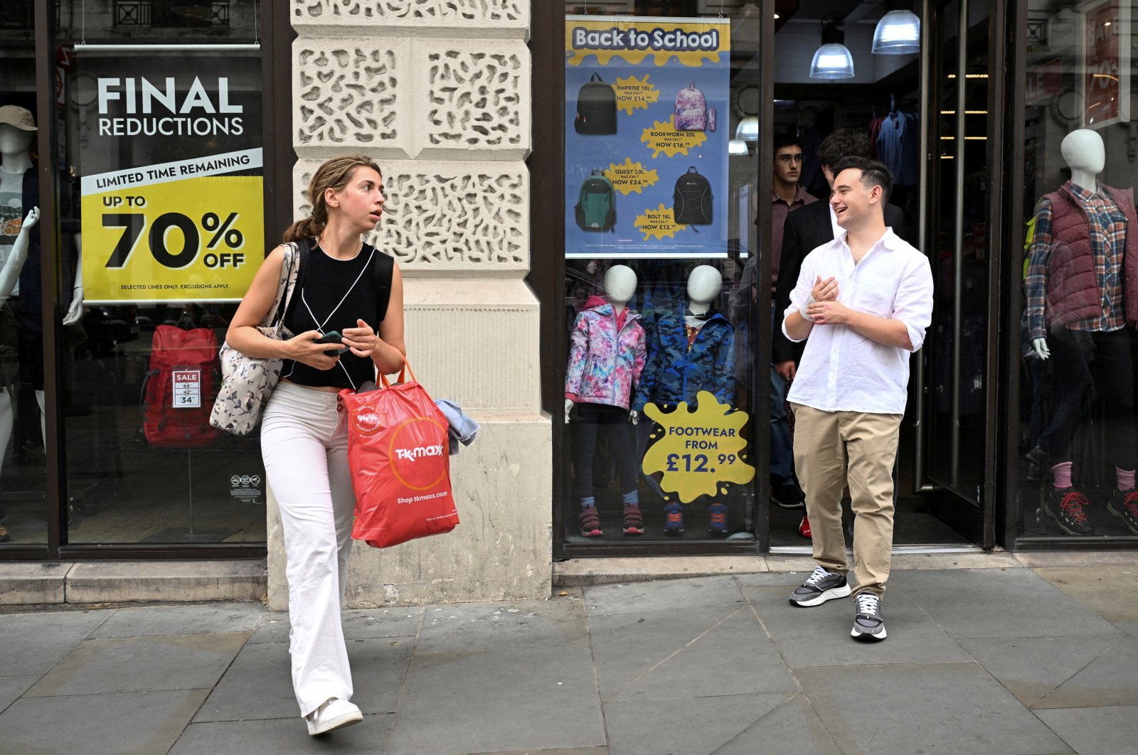 Shoppers walk past a store in Piccadilly Circus, London, U.K., Sept. 2, 2024. (Reuters Photo)