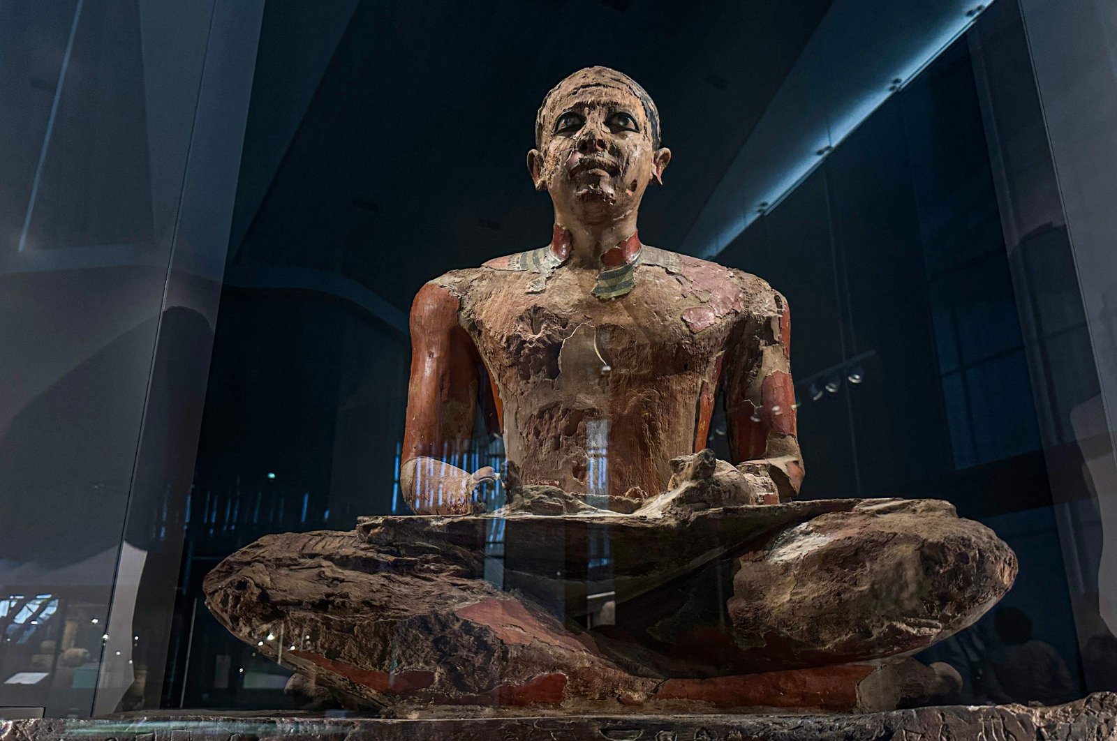 A colossal ancient Egyptian statue on display at the Grand Egyptian Museum in Giza during the trial opening of the Grand Egyptian Museum, Giza, Egypt, Oct. 15, 2024. (AFP Photo)