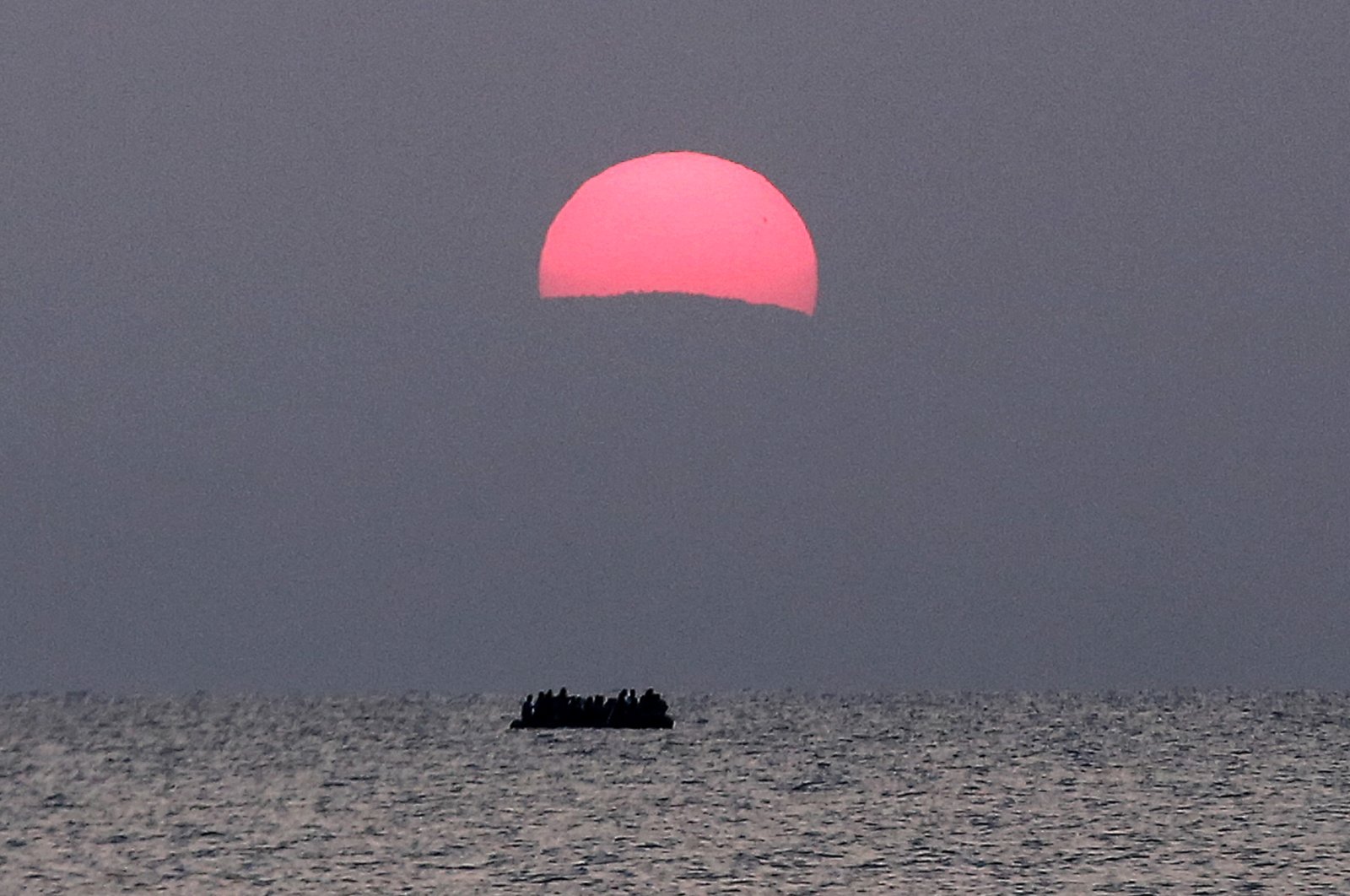 This file photo shows a dinghy with migrants a few miles off the southeastern island of Kos, Greece, Aug. 11, 2015. (AP Photo)