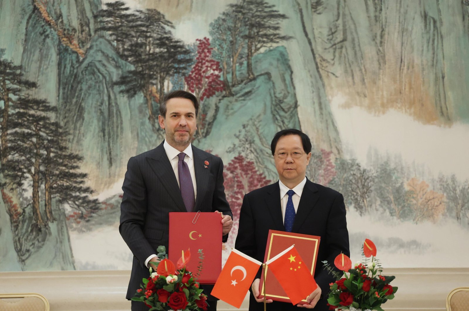 Treasury and Finance Minister Alparslan Bayraktar and his Chinese counterpart Wang Guanghua (R) during a ceremony to sign a memorandum of understanding on cooperation in the field of rare earth elements and mining, Tianjin, China, Oct. 16, 2024. (AA Photo)