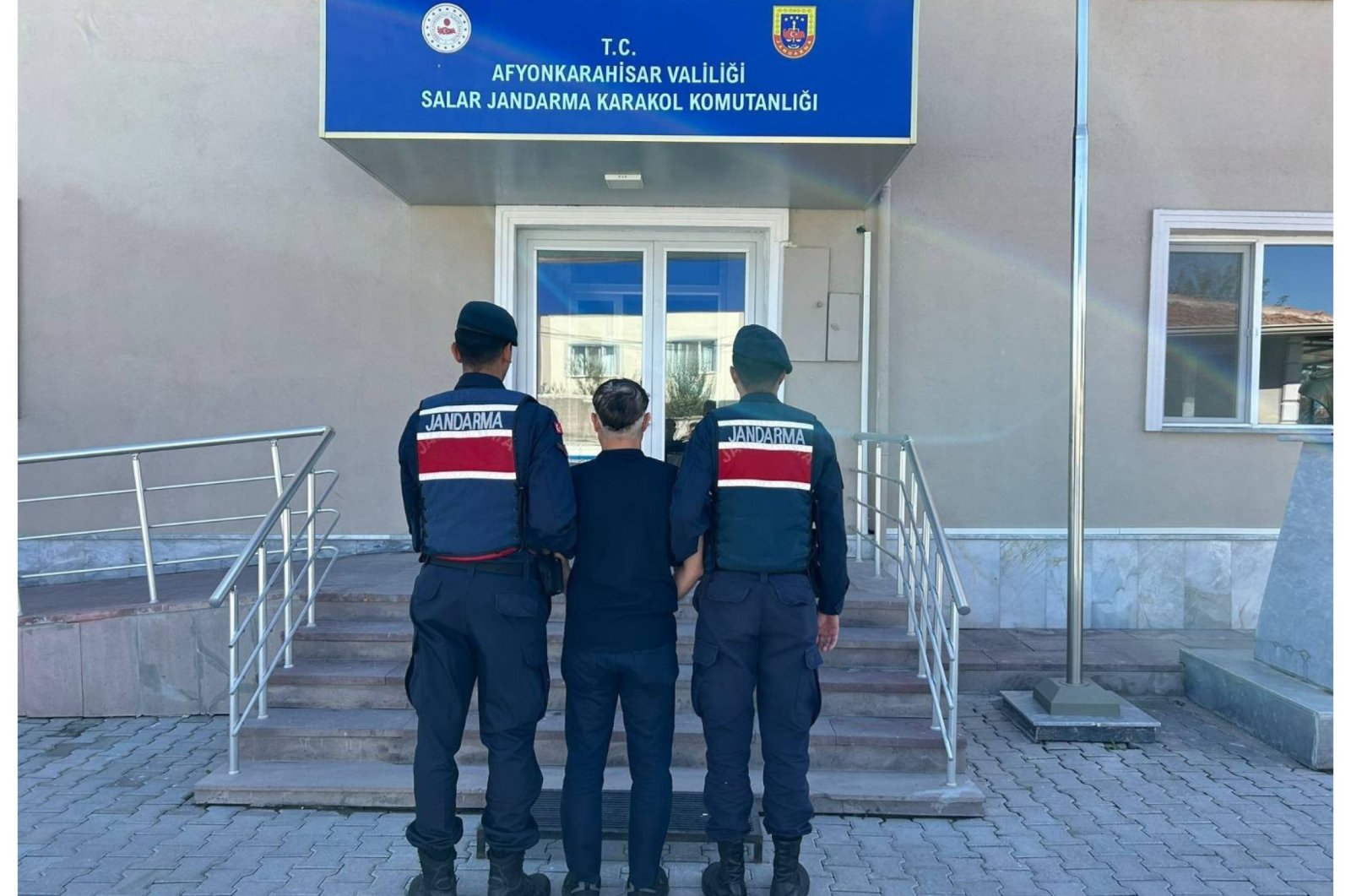 Gendarmerie forces escort a Gülenist Terror Group (FETÖ) suspect, western Afyonkarahisar province, Türkiye, Oct. 8, 2024. (IHA Photo)