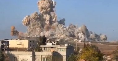 An image grab taken from a UGC video posted on social media shows soldiers observing massive explosions in the village of Mhaibib, southern Lebanon, Oct. 16, 2024. (AFP Photo)
