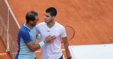 Spain's Rafael Nadal shakes hands with Spain's Carlos Alcaraz after their 2022 ATP Tour Madrid Open tennis tournament singles quarterfinals match at the Caja Magica, Madrid, Spain, May 6, 2022. (Getty Images Photo)