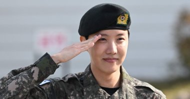 BTS member J-hope salutes after being discharged from his mandatory military service outside a military base, Wonju, South Korea, Oct. 17, 2024. (AFP Photo)