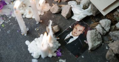 A picture of Liam Payne lays next to lit candles outside the hotel where former One Direction band member was found dead after he fell from a third-floor hotel room balcony, in Buenos Aires, Argentina, Oct. 17, 2024. (Reuters Photo)
