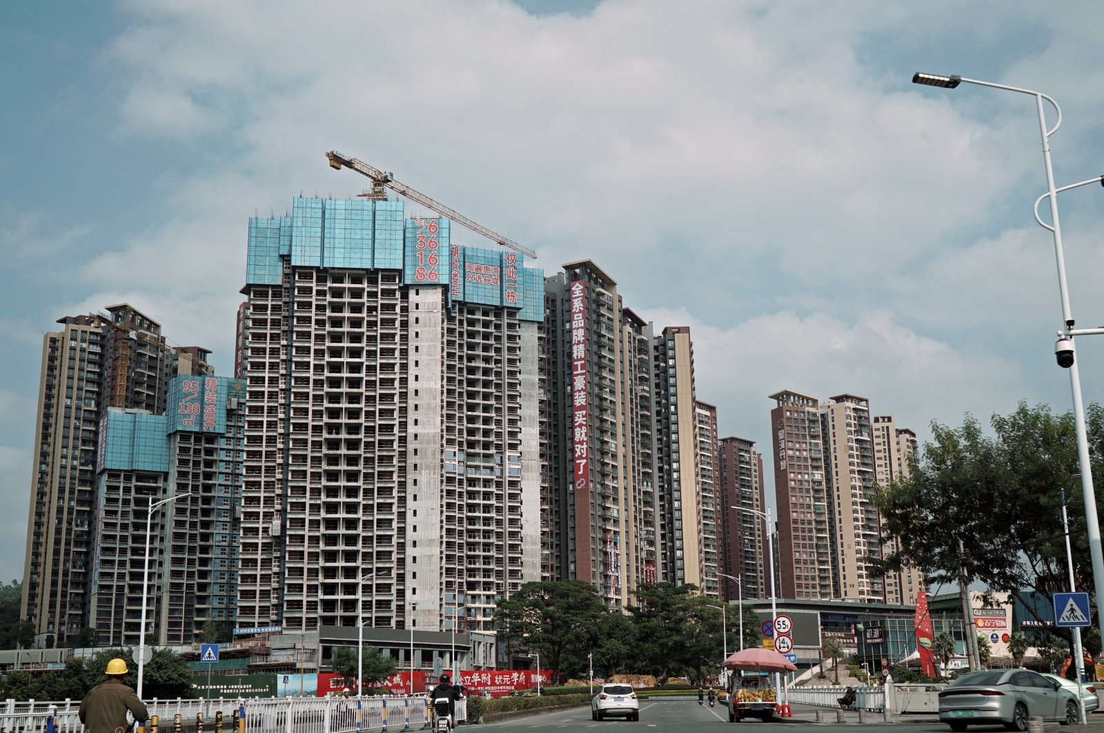 Sale signs adorn residential buildings under construction, Huizhou, Guangdong province, China, Oct. 10, 2024. (Reuters Photo)