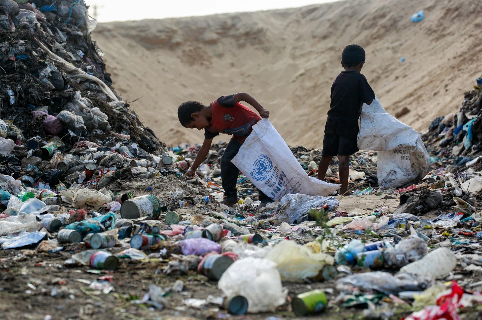 Children sift through waste at a landfill in Khan Younis amid Israel&#039;s brutal war, southern Gaza Strip, Palestine, Oct. 15, 2024. (AFP Photo)