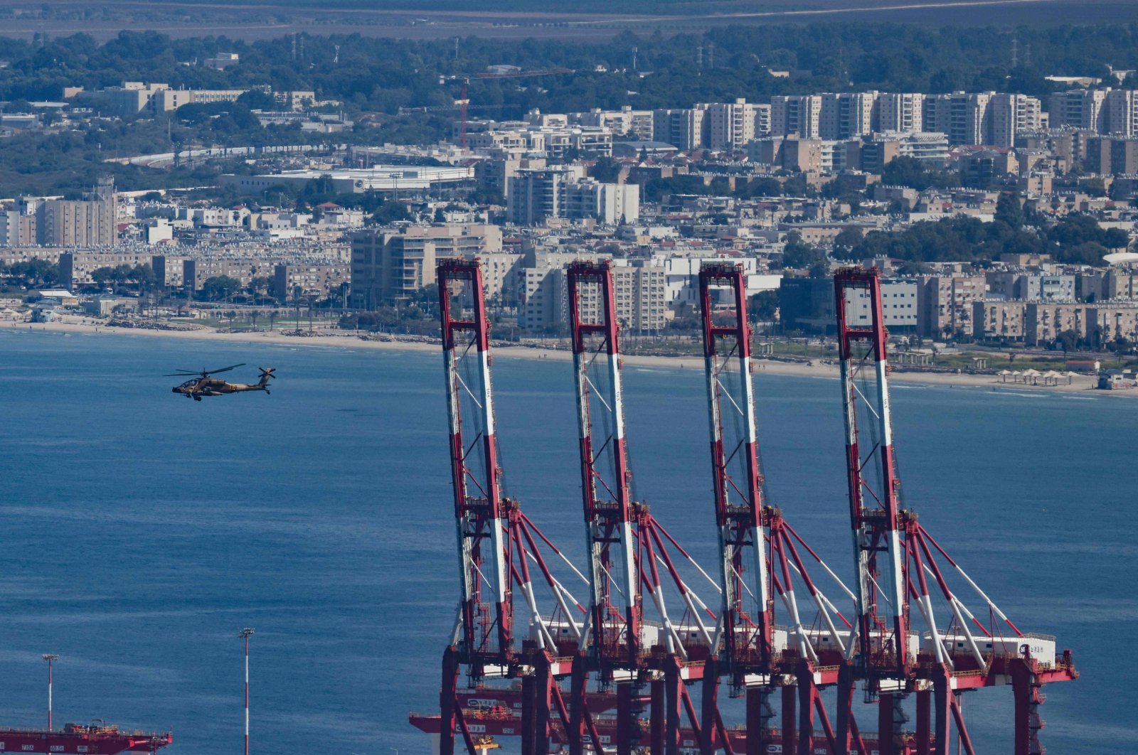 An Israeli army helicopter flies near the port of Haifa in northern Israel, Oct. 12, 2024. (AFP Photo)