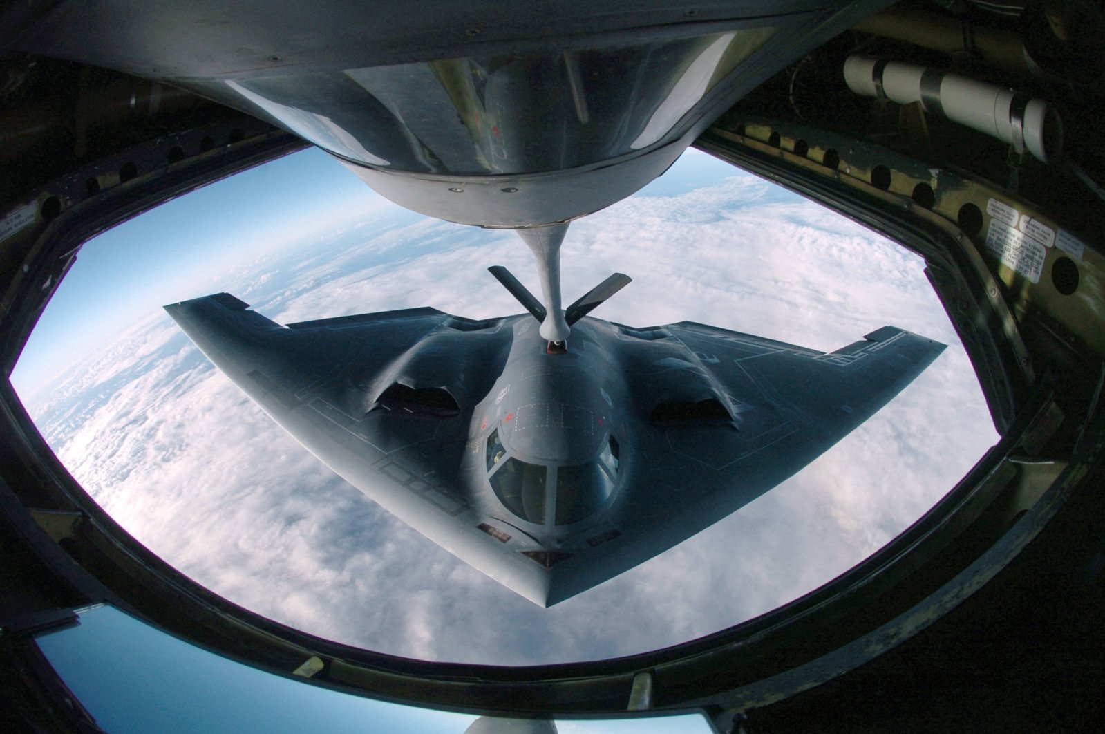 A B-2 Spirit multi-role bomber conducting air refueling operations with a KC-135 Stratotanker over the Pacific Ocen, April 4, 2005. (AFP Photo)