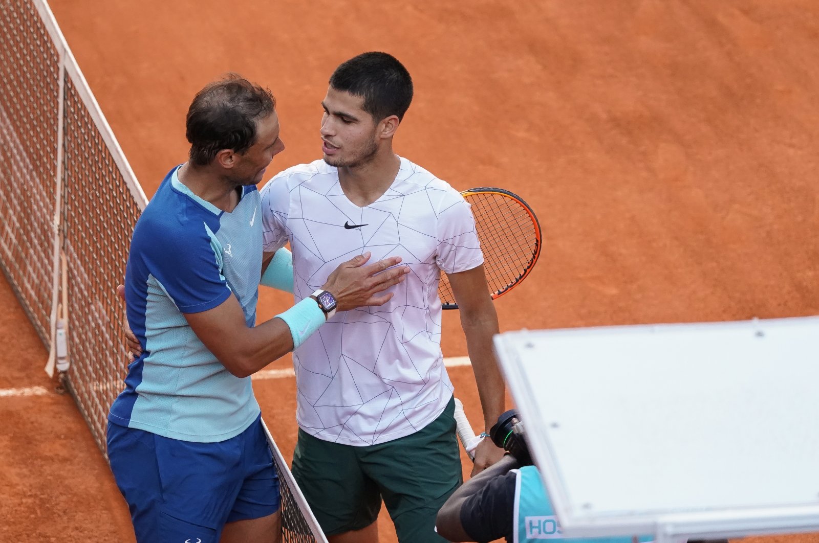 Spain&#039;s Rafael Nadal shakes hands with Spain&#039;s Carlos Alcaraz after their 2022 ATP Tour Madrid Open tennis tournament singles quarterfinals match at the Caja Magica, Madrid, Spain, May 6, 2022. (Getty Images Photo)