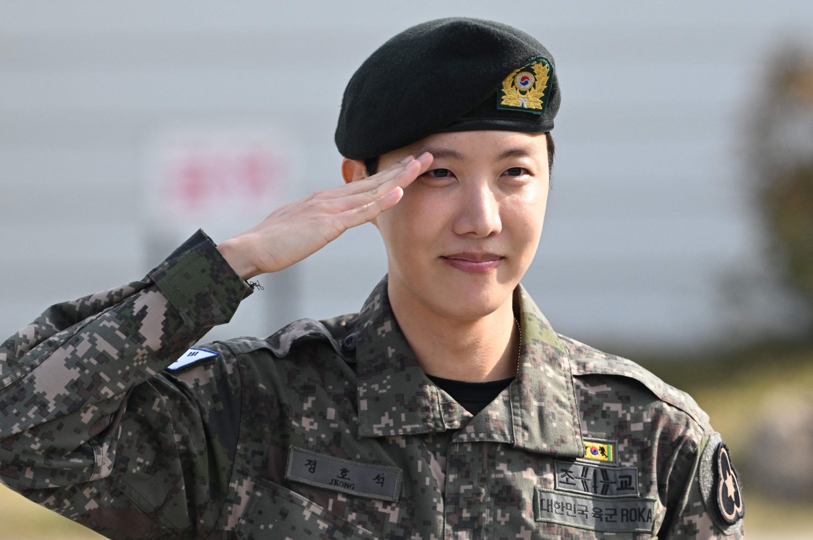 BTS member J-hope salutes after being discharged from his mandatory military service outside a military base, Wonju, South Korea, Oct. 17, 2024. (AFP Photo)