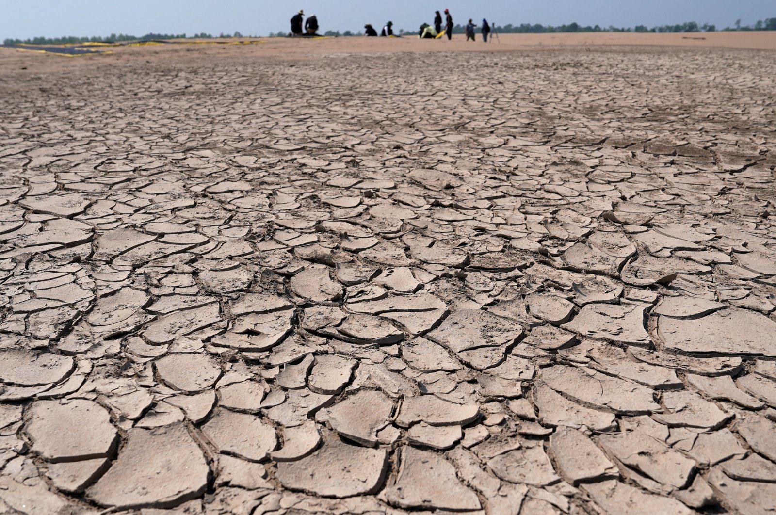 Greenpeace activists prepare a protest message over sandbanks exposed due to drought at the Solimoes River, one of the largest tributaries of the Amazon River, Brazil, Sept. 20, 2024. (Reuters Photo)