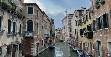 Gondolas and historic buildings along the canals of Venice, Italy, June 3, 2024. (Photo by İlker Topdemir)