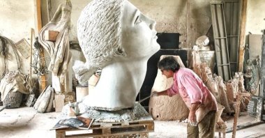 Italian sculptor Giacinto Bosco making his final touches to his artwork. (Courtesy of Giacinto Bosco)