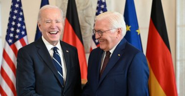 U.S. President Joe Biden (L) and German President Frank-Walter Steinmeier react as they shake hands at Bellevue presidential palace, Berlin, Germany, Oct. 18, 2024. (AFP Photo)
