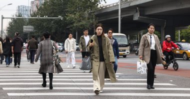 People walk in the central business district of Beijing, China, Oct. 18, 2024. (EPA Photo)