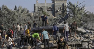 Palestinians search among the rubble of a destroyed house following Israeli airstrikes in the Al-Maghazi refugee camp, Gaza Strip, Oct. 17, 2024. (EPA Photo)