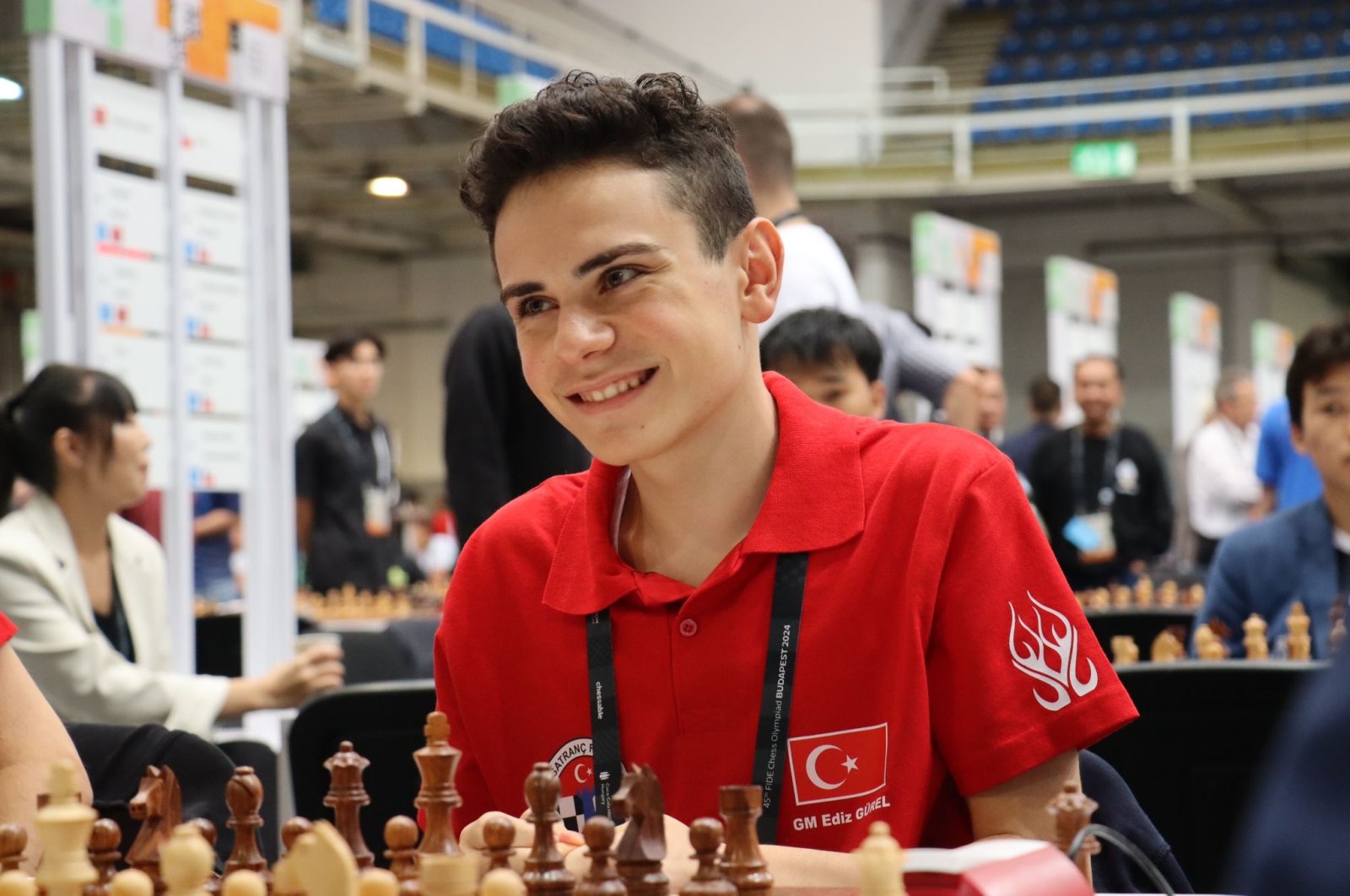 Turkish chess youngster Ediz Gürel smiles during a World Chess Olympiad match, Ankara, Türkiye, Sept. 23, 2024. (DHA Photo)