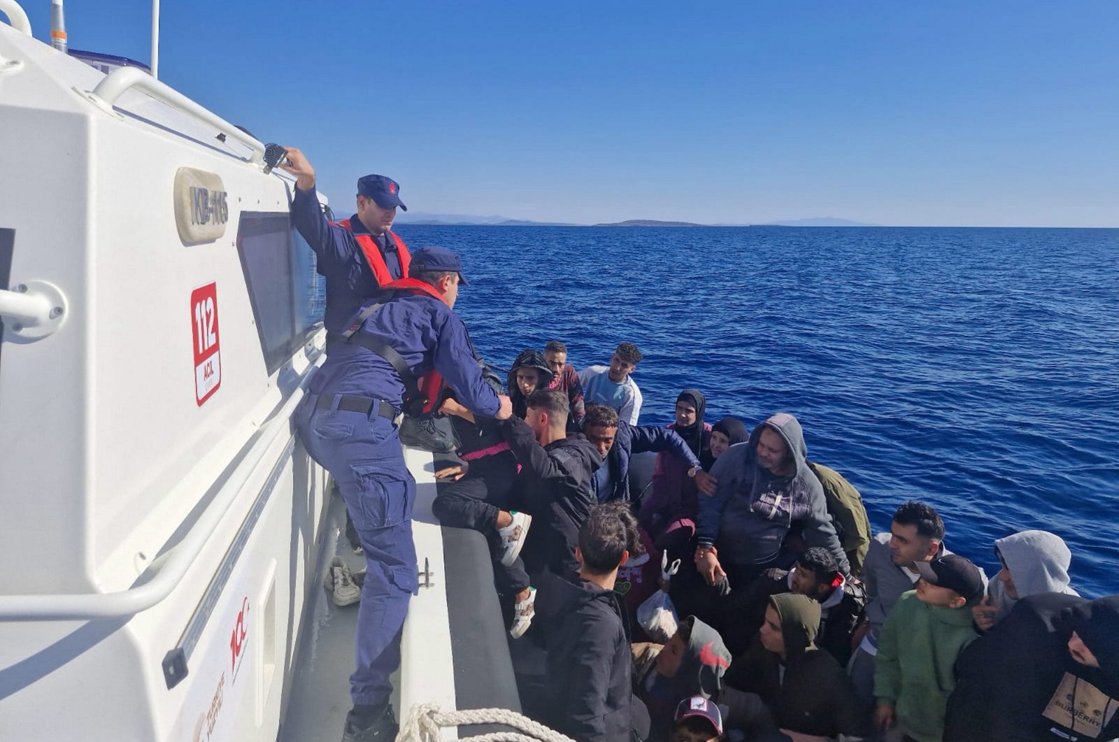 The Turkish coast guard picks up a dinghy carrying 24 irregular migrants pushed back by Greece, off the coast of Balıkesir province, Türkiye, Oct. 17, 2024. (AA Photo)