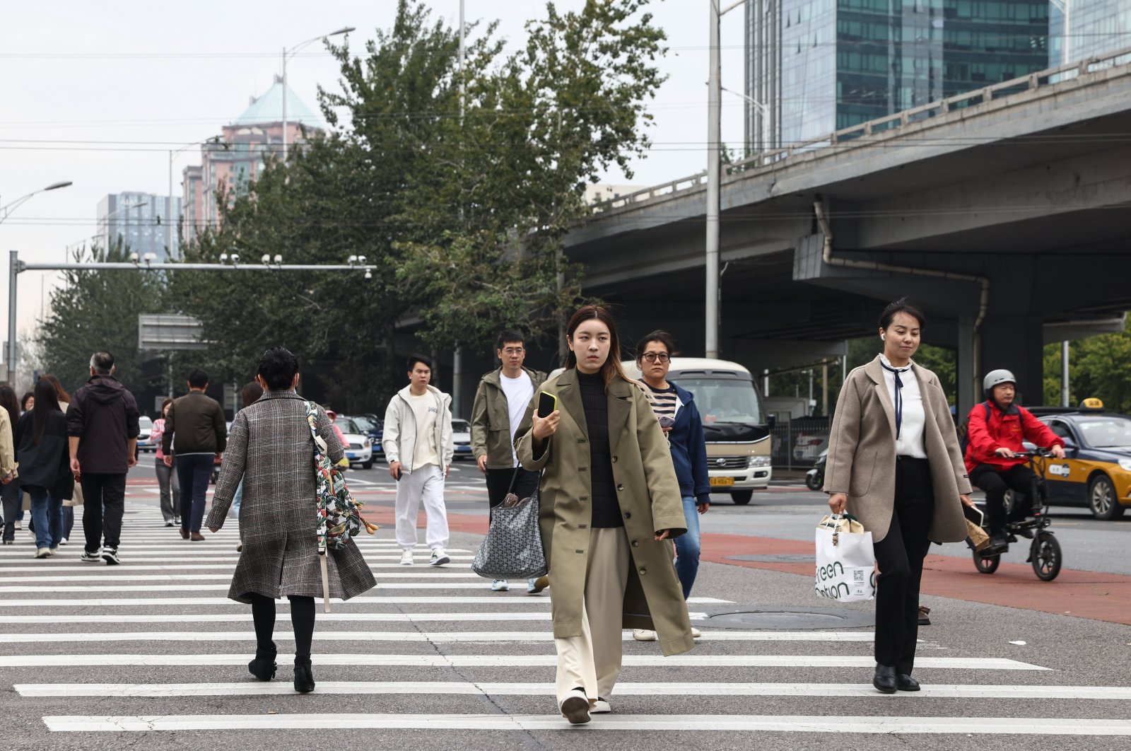 People walk in the central business district of Beijing, China, Oct. 18, 2024. (EPA Photo)