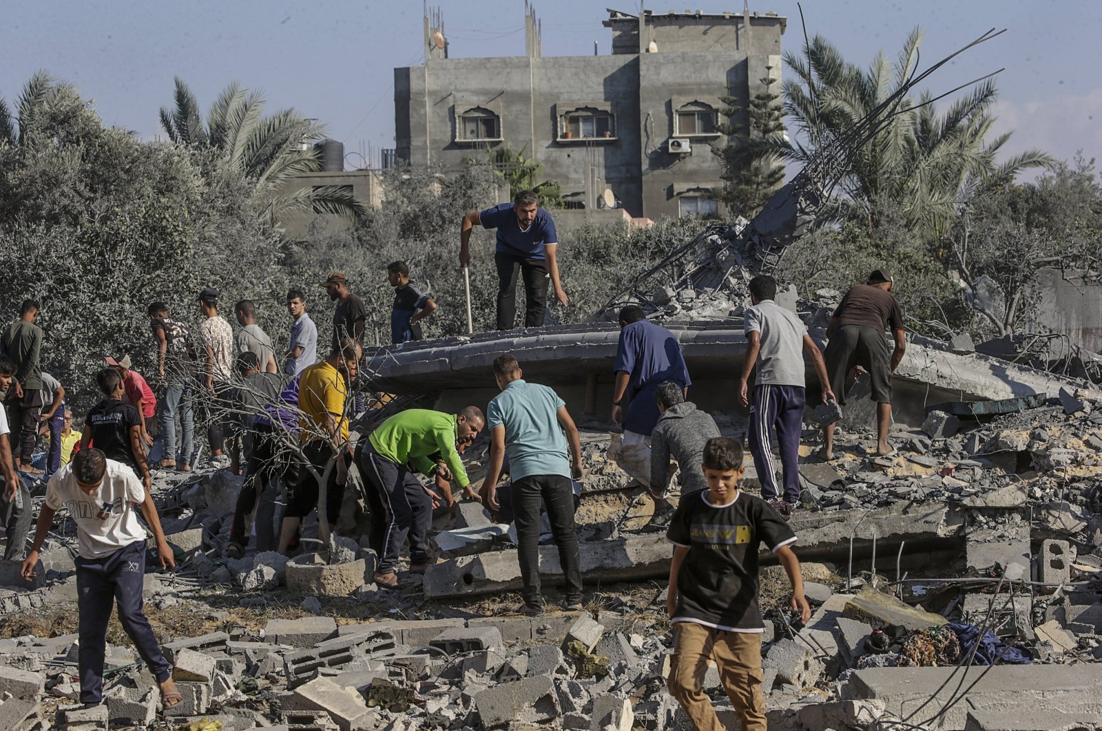 Palestinians search among the rubble of a destroyed house following Israeli airstrikes in the Al-Maghazi refugee camp, Gaza Strip, Oct. 17, 2024. (EPA Photo)