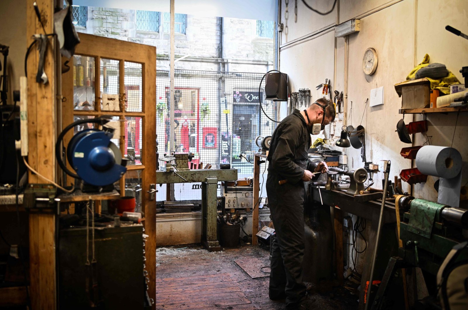 Artisan bagpipe maker Ruari Black, the last traditional bagpipe-makers who make everything by hand from start to finish, makes a bagpipe chanter in the workshop of Kilberry Bagpipes, Edinburgh, Scotland, Oct. 7, 2024. (AFP Photo)