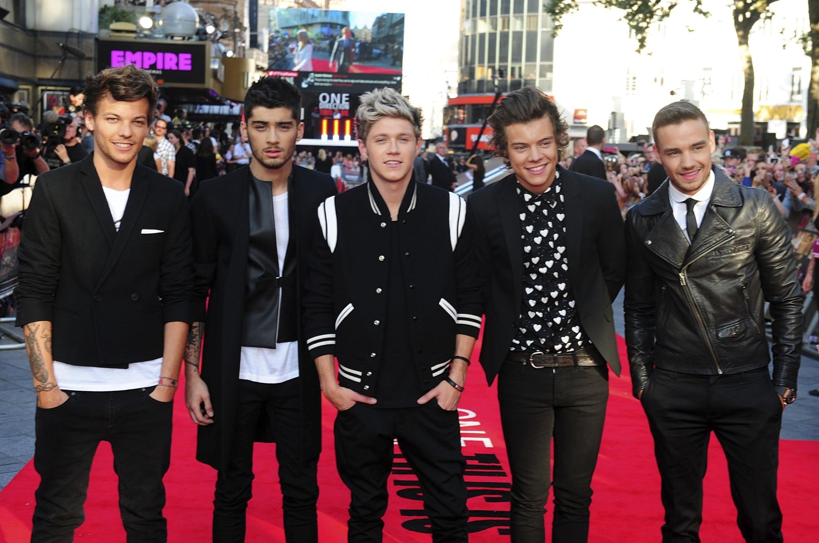 From left to right, Louis Tomlinson, Zayn Malik, Niall Horan, Harry Styles and Liam Payne arrive for the World Premiere of &quot;One Direction: This Is Us,&quot; at the Empire Leicester Square, London, U.K. Aug. 20, 2013. (AP Photo)