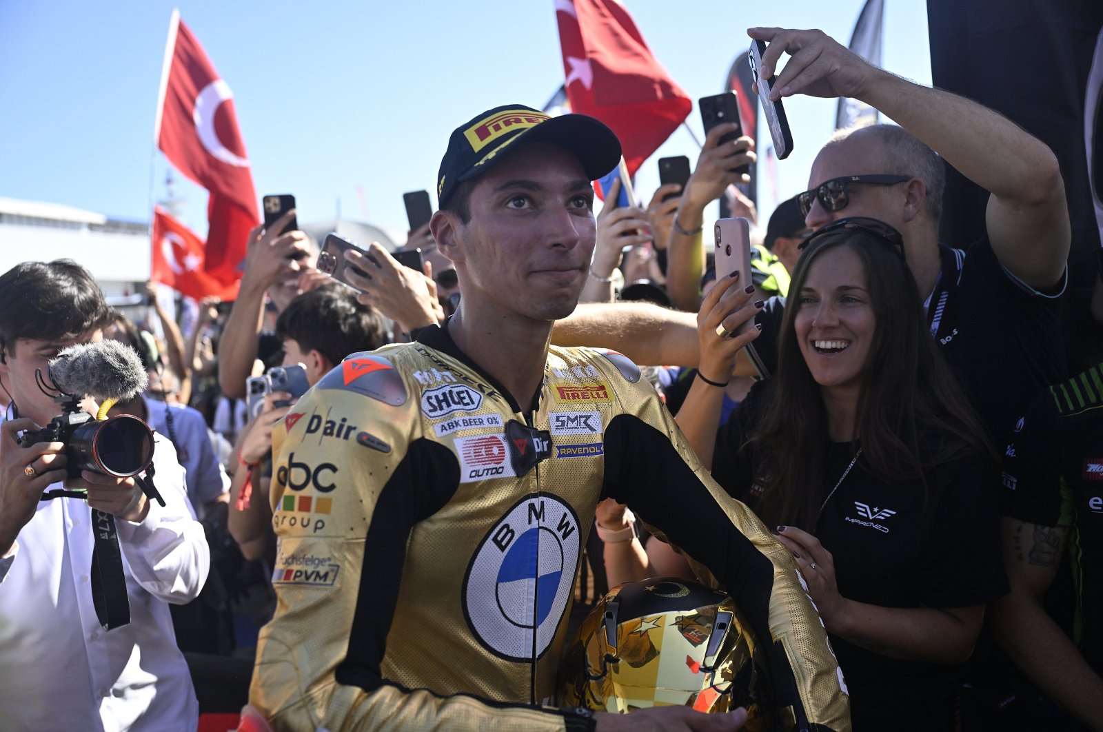 Turkish rider Toprak Razgatlıoğlu (C) after winning the 2024 WSBK title in Jerez, Spain, Oct. 19, 2024. (AA Photo)