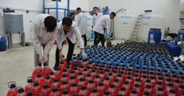 The Bitlis Eren University team works on liquid soap produced from Lake Van's alkaline waters, Bitlis, Türkiye, Oct. 21, 2024. (IHA Photo)