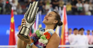 Belarus' Aryna Sabalenka celebrates with the trophy after winning her Wuhan Open final match against China's Qinwen Zheng at the Optics Valley International Tennis Center, Wuhan, China, Oct. 13, 2024. (Reuters Photo)