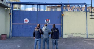 Police officers escort a wanted FETÖ fugitive to a correctional facility in central Nevşehir province, Türkiye, Oct. 21, 2024. (IHA Photo)