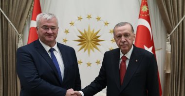President Recep Tayyip Erdoğan and Ukraine's Foreign Minister Andrii Sybiha shake hands in Ankara, Oct. 21, 2024. (AA Photo)