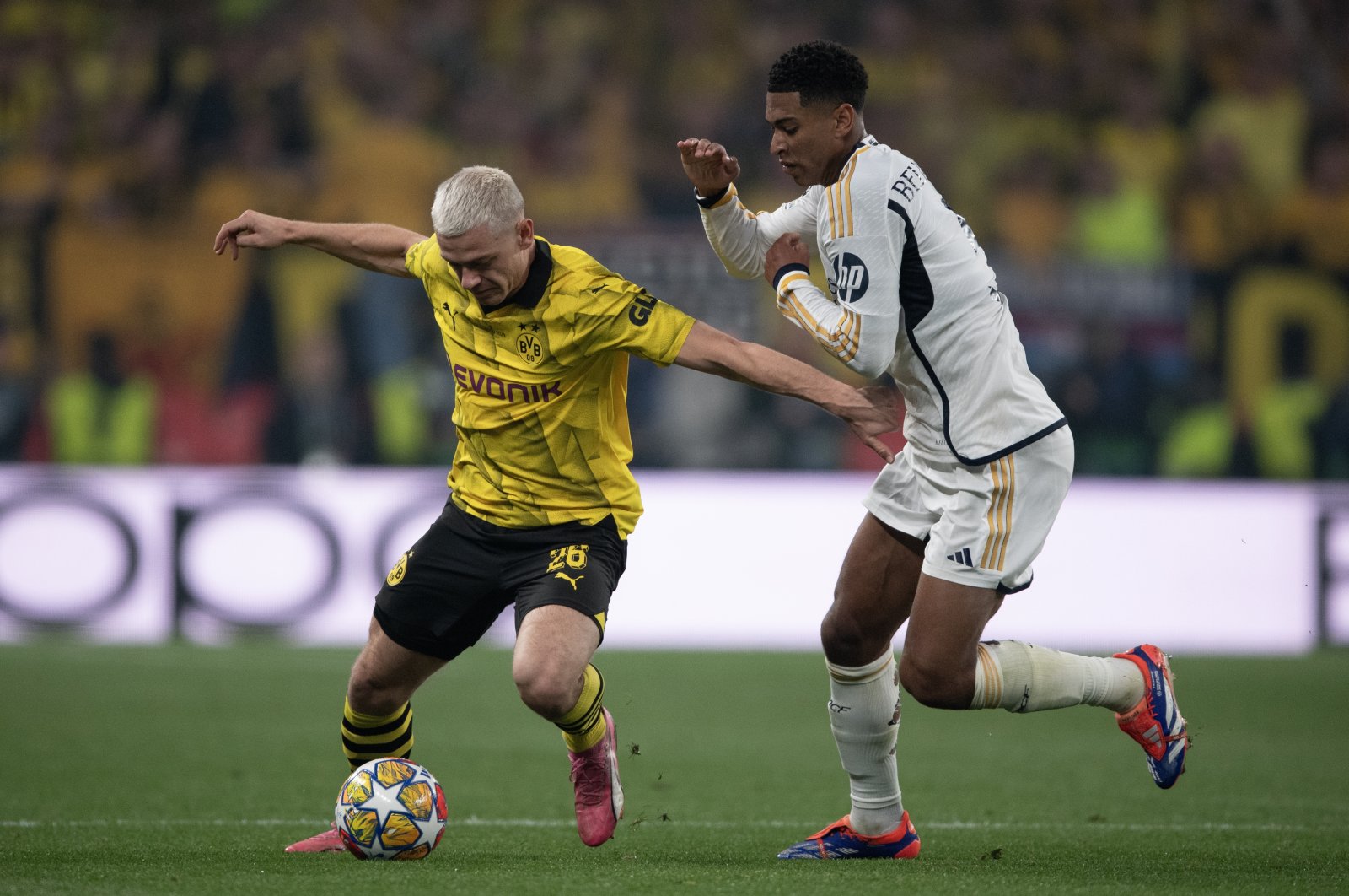 Borussia Dortmund&#039;s Julian Ryerson (L) and Real Madrid&#039;s Jude Bellingham in action during the UEFA Champions League 2023/24 final match between Borussia Dortmund vs. Real Madrid CF at Wembley Stadium, London, U.K., June 1, 2024. (Getty Images Photo)