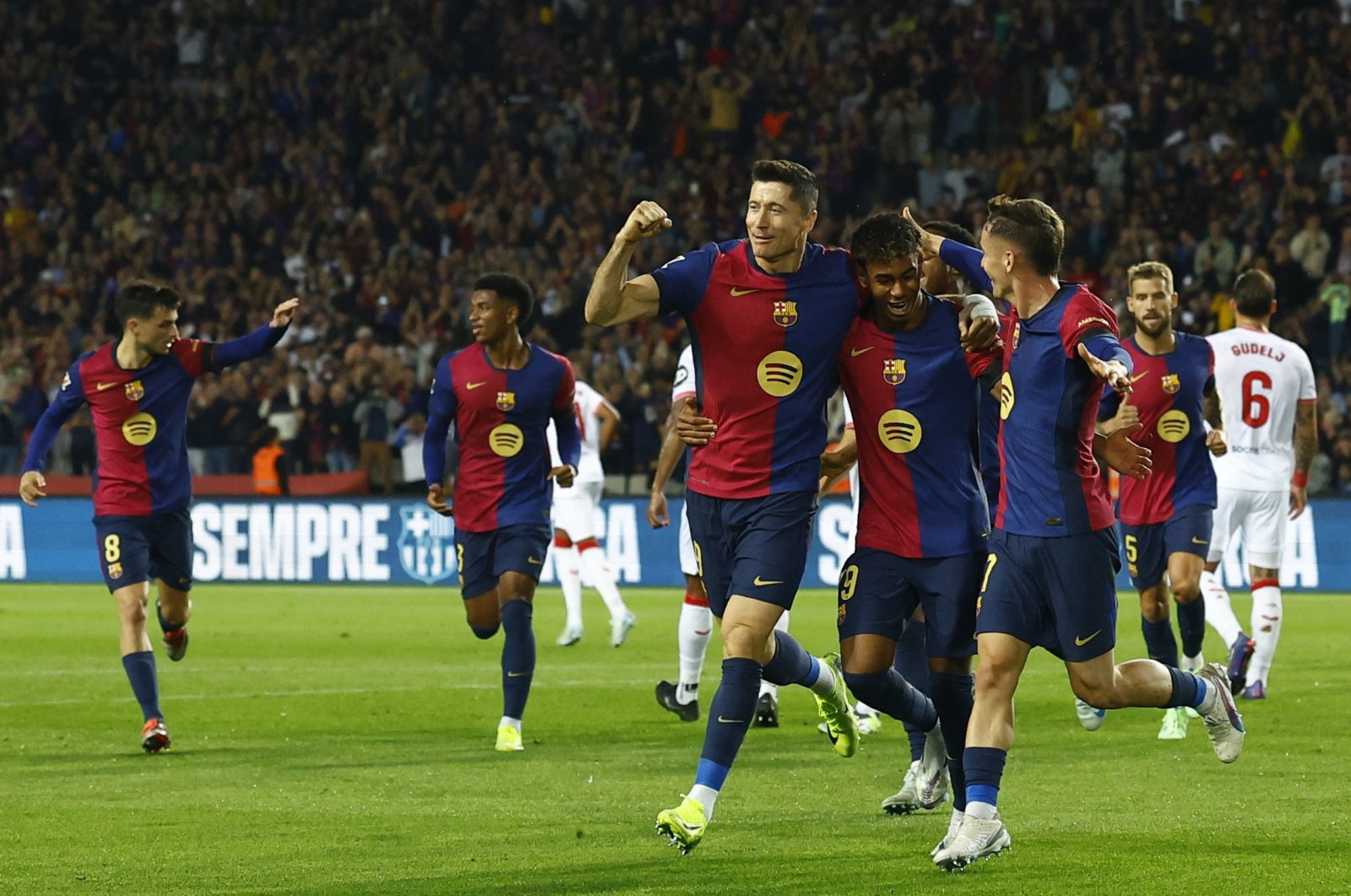 Barcelona&#039;s Robert Lewandowski (C) celebrates with his teammates after scoring during a La Liga match against Sevilla at the Estadi Olimpic Lluis Companys, Barcelona, Spain, Oct. 20, 2024. (Reuters Photo)