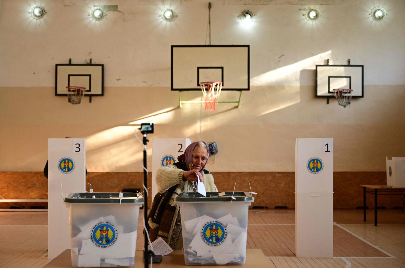 A woman casts her ballots for the presidential election and referendum on joining the EU at a polling station, in Bulboaca village, Moldova, Oct. 20, 2024. (AFP Photo)