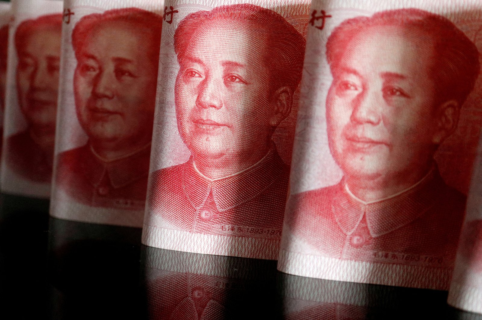 Chinese yuan banknotes are seen in this illustration picture taken on April 25, 2022. (Reuters Photo)