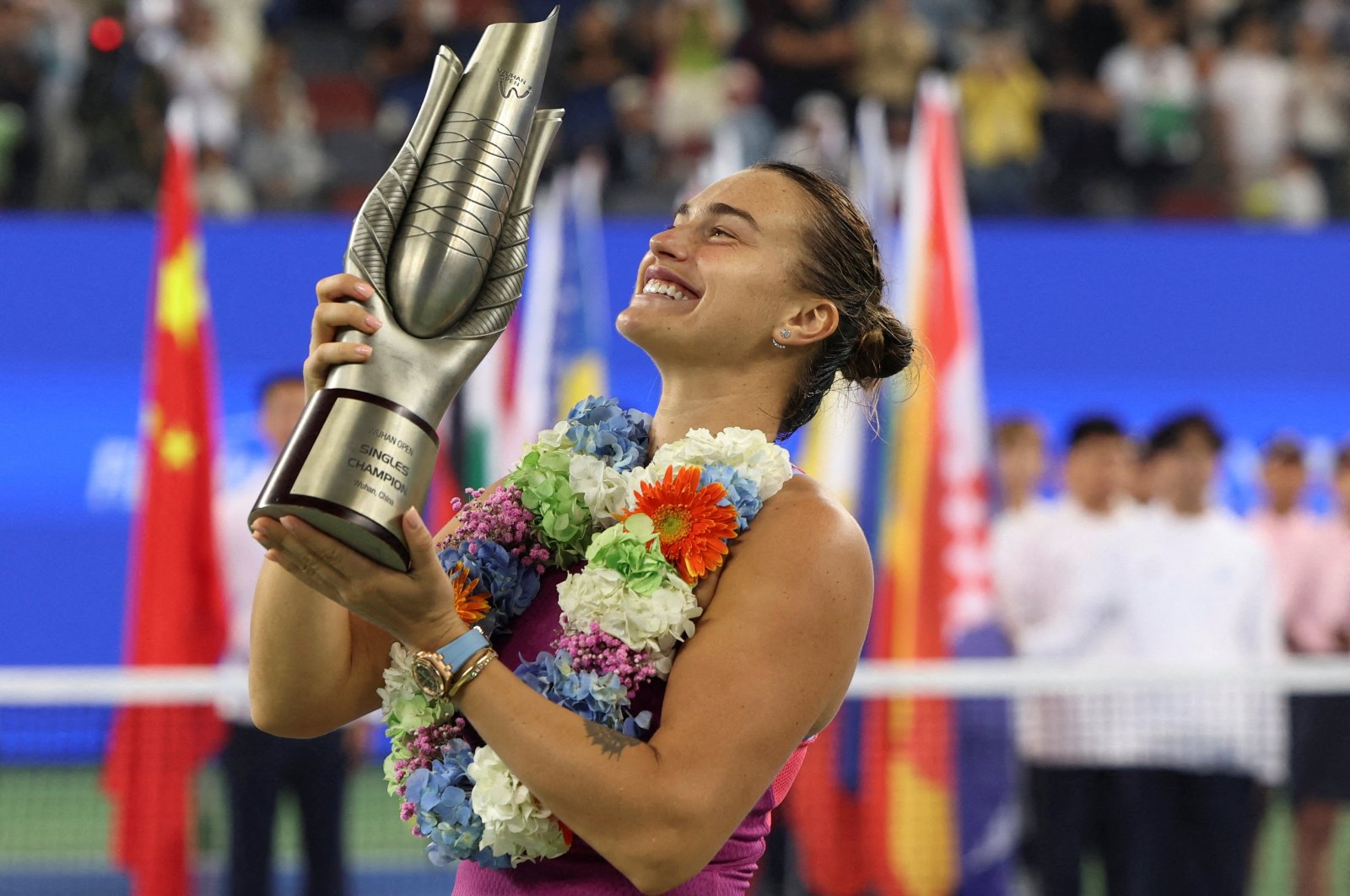 Belarus&#039; Aryna Sabalenka celebrates with the trophy after winning her Wuhan Open final match against China&#039;s Qinwen Zheng at the Optics Valley International Tennis Center, Wuhan, China, Oct. 13, 2024. (Reuters Photo)