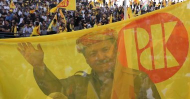 Iraqi Kurds wave flags as they attend an electoral campaign for the Kurdistan Democratic Party (KDP) at a stadium in Irbil, Iraq, Oct. 15, 2024. (AFP Photo)