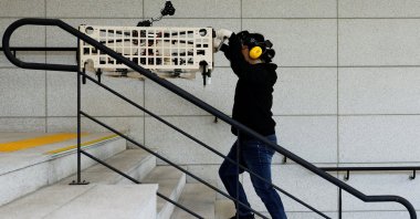 Park Hyun-geun, a graduate student of Mechanical Design and Robot Engineering, demonstrates the aerial transportation platform Palletrone on stairs, Seoul, South Korea, Oct. 10, 2024. (Reuters Photo)