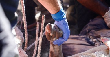 Rescuers find a dead body at the site of an Israeli strike near Rafik Hariri University Hospital, in Beirut, Lebanon, Oct. 22, 2024. (Reuters Photo)